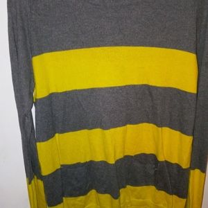 Grey and yellow sweater.